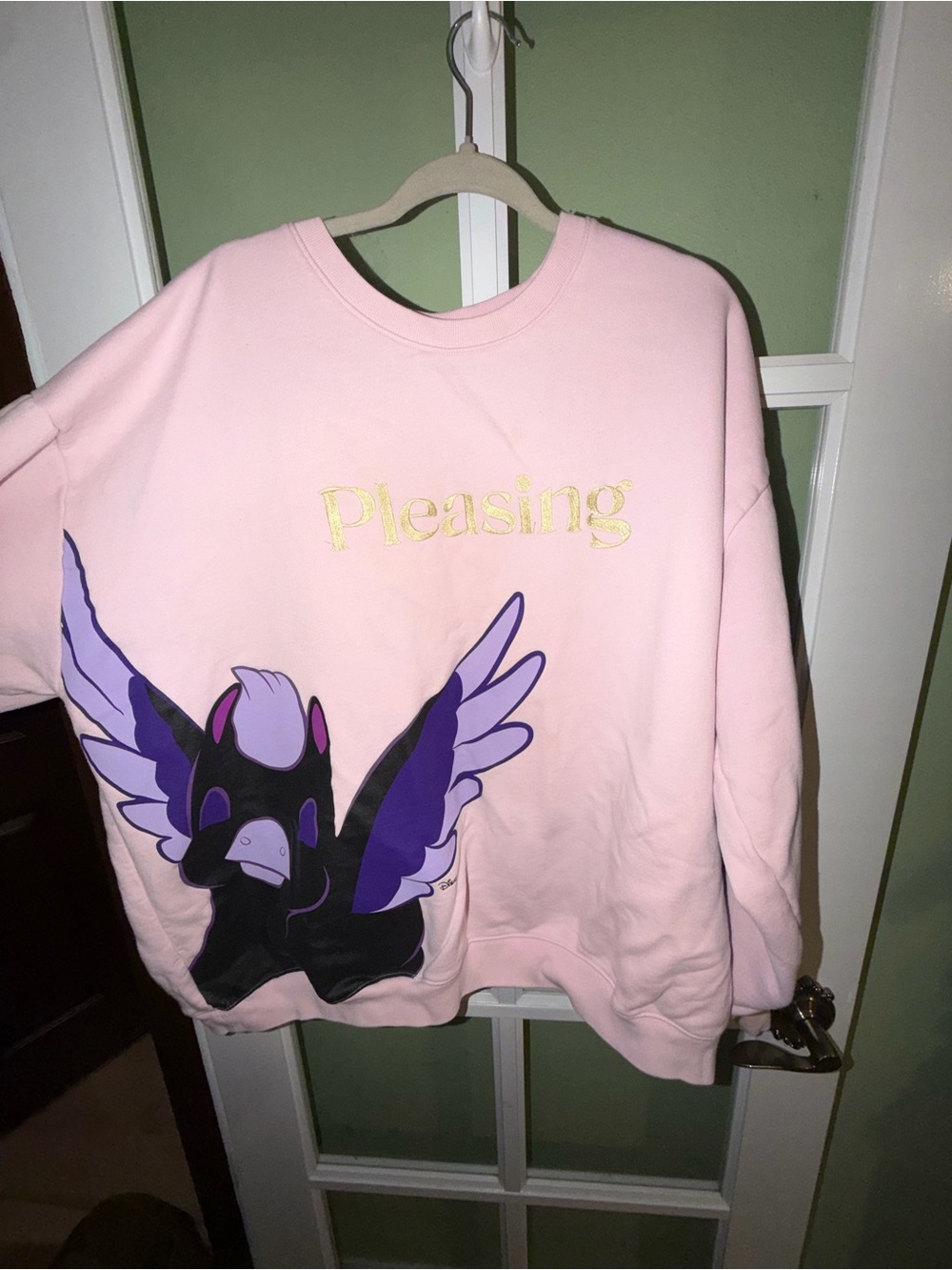 Pleasing Pink Crewneck Sweatshirt with Purple Wing Graphic